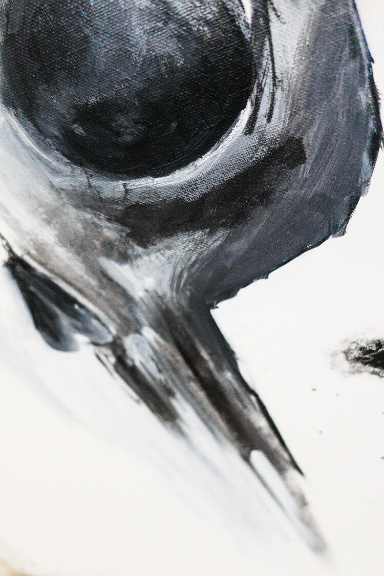 Black and white skull painting with dramatic dripping effects and ink splatters on a textured background.