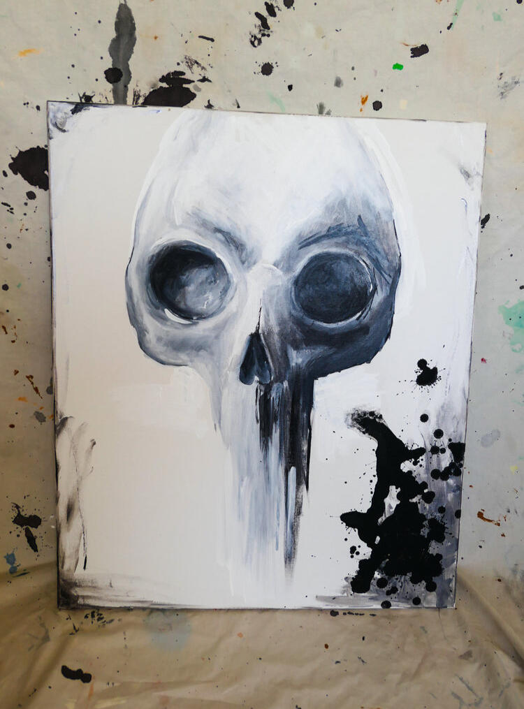 Black and white skull painting with dramatic dripping effects and ink splatters on a textured background.